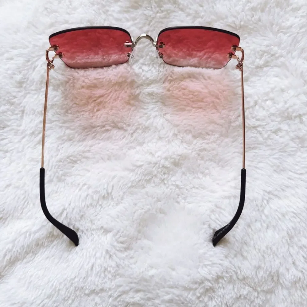 Laurel Clear Orange Rimless Sleek Sunglasses